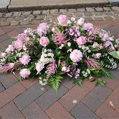 Soft pink casket spray 