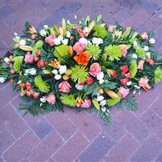 Orange casket spray 